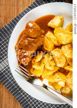 Beef roulade with baked potatoes. Beef roulade with baked potatoes. 134558517