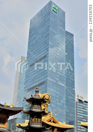 Historic Buddhist temple complex of Jingan Temple on the West Nanjing Road in downtown Shanghai, China 134558703