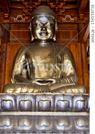 Buddha in historic Buddhist Jingan Temple on the West Nanjing Road in Shanghai, China Buddha in historic Buddhist Jingan Temple on the West Nanjing Road in Shanghai, China 134558716