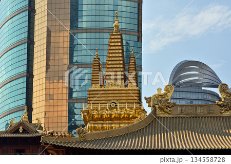 Historic Buddhist temple complex of Jingan Temple on the West Nanjing Road in downtown Shanghai, China 134558728