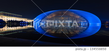 National Centre for the Performing Arts NCPA reflecting in the water at night in Beijing, China National Centre for the Performing Arts NCPA reflecting in the water at night in Beijing, China 134558850