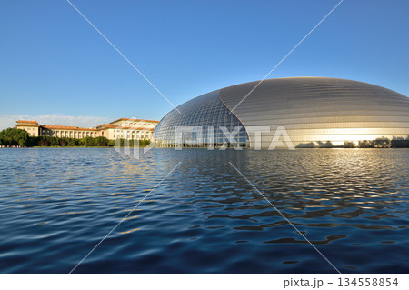 National Centre for the Performing Arts NCPA reflecting in the water in Beijing, China National Centre for the Performing Arts NCPA reflecting in the water in Beijing, China 134558854
