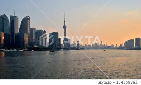 Cityscape sunset view across Huangpu River of Oriental Pearl Tower and Pudong new area in Shanghai, China 134558863