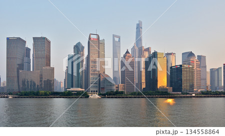 Cityscape sunset view across Huangpu River of skyscrapers in Pudong new area in Shanghai, China 134558864