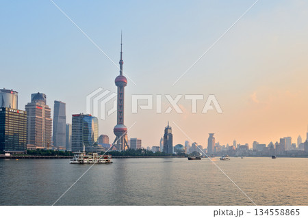 Cityscape sunset view across Huangpu River of Oriental Pearl Tower and Pudong new area in Shanghai, China 134558865