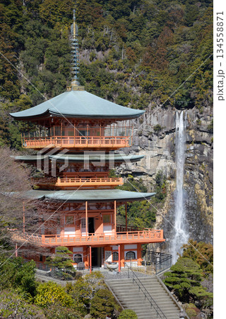 Three story pagoda of Seiganto-ji Tendai Buddhist temple in Wakayama Prefecture, Japan with Nachi Falls in the background 134558871