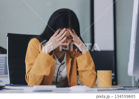 Headache, business woman at night and computer stress while working for a deadline with pc glitch. Sad corporate manager with anxiety about target working at desk screen late to complete task online Headache, business woman at night and computer stress while working for a deadline with pc glitch. Sad corporate manager with anxiety about target working at desk screen late to complete task online 134559605