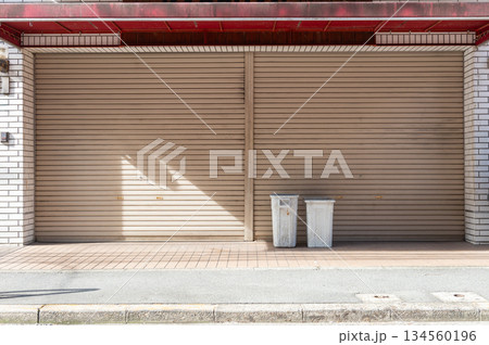 A closeup shot of automatic metal roller door used in factory, storage, garage, and industrial warehouse. The corrugated and foldable metal sheet offer space saving and provide urban and rustic feel 134560196