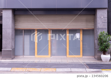 sorry we are closed sign hanging outside a restaurant, store, office or other 134560206