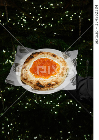 Bokehlit Grilled Seafood Dish, Server Presents Outdoor Pizza Amid Festive Glowing Environment Bokehlit Grilled Seafood Dish, Server Presents Outdoor Pizza Amid Festive Glowing Environment 134562384