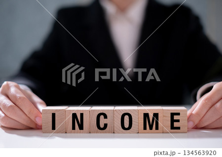 Income increase business finance growth on wooden block currency wealth investment concept 134563920