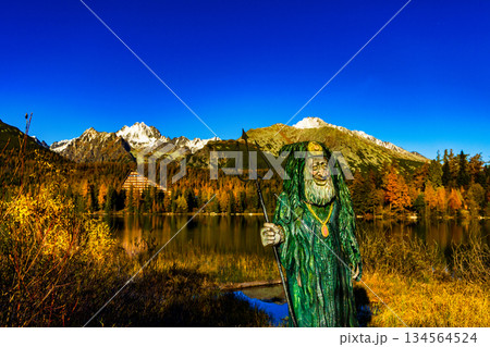 Majestic High Tatra mountains panorama reflected in lake during autumn 134564524