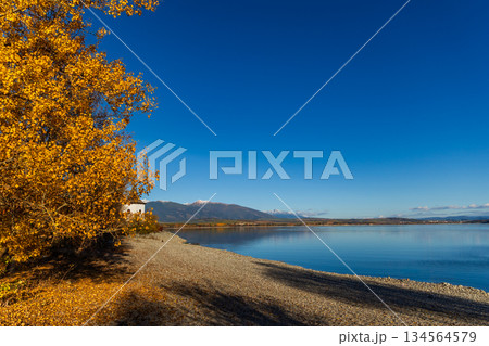 Old church tower of Havranok by Liptovska Mara lake with Tatra mountains in autumn 134564579