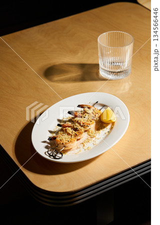 Seafood Skewer With Citrus On Round Table, Fresh Grilled Shrimp Served With Lemon On Rustic Table 134566446