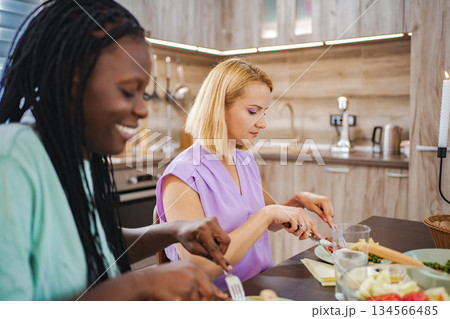Savoring a meal in a modern kitchen 134566485