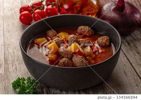 Tomato soup with meatballs and vegetables Tomato soup with meatballs and vegetables 134566894