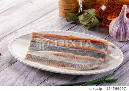 Marinated salted herring fillet slices 134566967