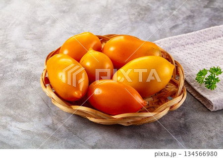 Sweet juicy ripe yellow tomato Sweet juicy ripe yellow tomato 134566980