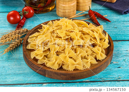 Raw dry farfalle for cooking 134567150