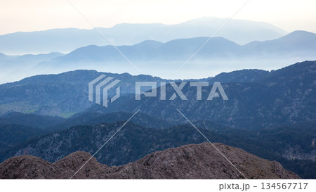 Mountainous landscape in Turkey showcasing serene blue hues at dawn 134567717