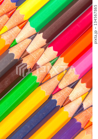 Multicolored pencils stacked in a grid formation, showcasing a rainbow of shades Multicolored pencils stacked in a grid formation, showcasing a rainbow of shades 134567865
