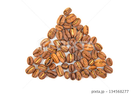 Macro shot of roasted coffee beans with deep brown tones and cracked surfaces 134568277