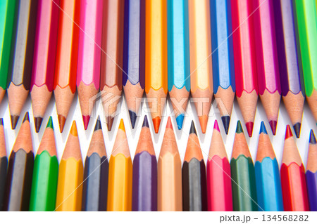 Sharpened multicolored pencils in a grid pattern. Suitable for art supplies Sharpened multicolored pencils in a grid pattern. Suitable for art supplies 134568282
