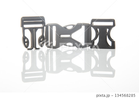 Fastex plastic clip for backpacks, bags, nylon belts on a white background Fastex plastic clip for backpacks, bags, nylon belts on a white background 134568285