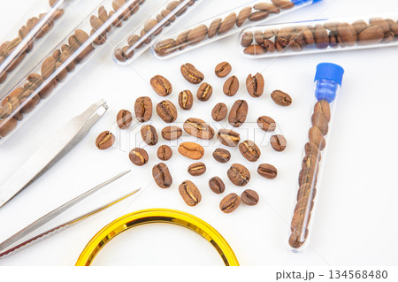 Quality control in coffee production roasted beans under scientific examination using lab equipment Quality control in coffee production roasted beans under scientific examination using lab equipment 134568480