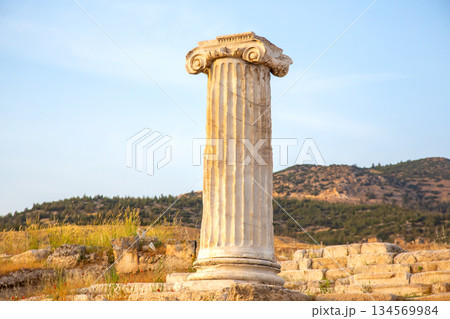 Ancient column at sunset in Turkey highlighting historical architecture and nature 134569984