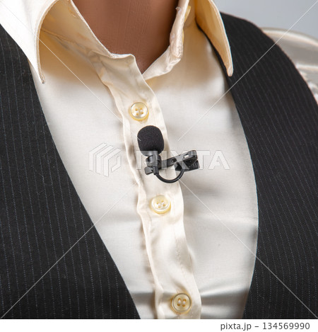 Broadcast microphone attached to a vest during a live presentation session Broadcast microphone attached to a vest during a live presentation session 134569990
