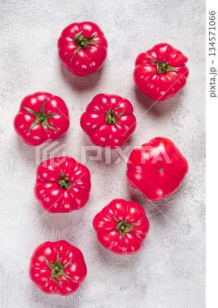 pink tomatoes scattered on the table, top view, close-up, no people, pink tomatoes scattered on the table, top view, close-up, no people, 134571066