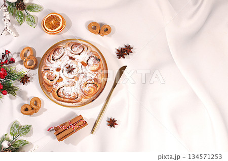 Homemade winter dessert, pie or cupcake with nuts, cinnamon, cranberries and poppy seeds, as well as egg liqueur.Festive kitchen banner. The concept of festive pastries, seasonal treats 134571253