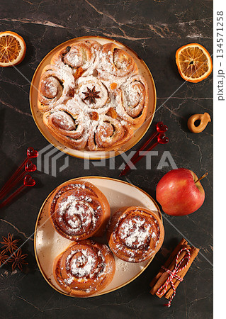 Apple pies, buns, cupcakes with apples, cinnamon, poppy seeds, cranberries, and egg liqueur.Homemade winter dessert,Festive kitchen banner. The concept of festive pastries, seasonal treats Apple pies, buns, cupcakes with apples, cinnamon, poppy seeds, cranberries, and egg liqueur.Homemade winter dessert,Festive kitchen banner. The concept of festive pastries, seasonal treats 134571258