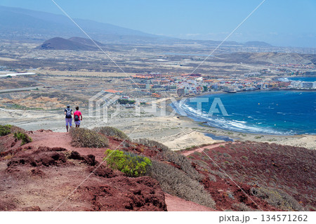 Aerial view of Tenerife beautiful coastline near El Medano, sunny summer day, Canary Islands, overtourism protests concept, Spain Aerial view of Tenerife beautiful coastline near El Medano, sunny summer day, Canary Islands, overtourism protests concept, Spain 134571262