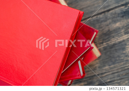 Pile of new books. Books in red covers. Training and education on the pages of books. 134571321