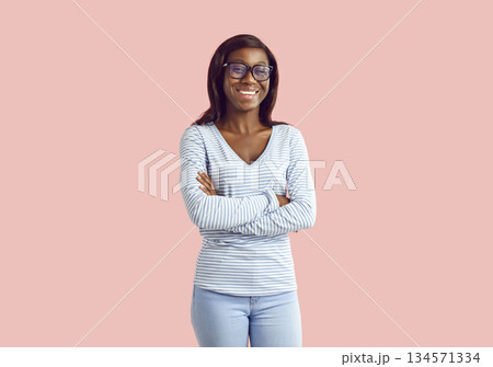 African american woman in glasses with confident smile, successful lady proud of being self African american woman in glasses with confident smile, successful lady proud of being self 134571334
