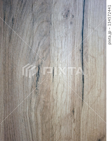 This wood laminate texture displays natural lines and variations in color that can be used for flooring, furniture, and wall design. It highlights the beauty of wood elements in home decor. This wood laminate texture displays natural lines and variations in color that can be used for flooring, furniture, and wall design. It highlights the beauty of wood elements in home decor. 134572441