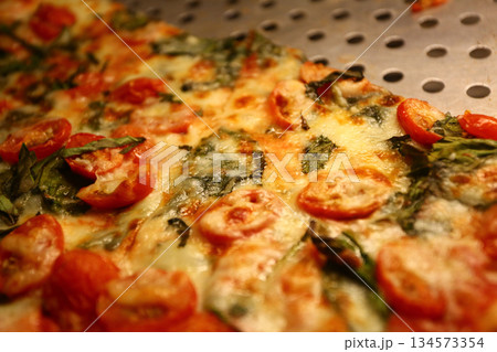 cheese and tomato pizzas as italian food 134573354