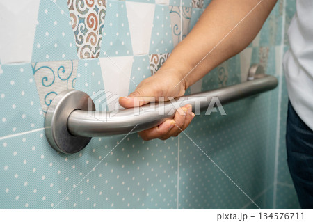Asian elderly woman use toilet bathroom handle security, healthy strong medical. Asian elderly woman use toilet bathroom handle security, healthy strong medical. 134576711