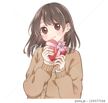 ハート型の箱に入ったチョコレートを持ったバレンタインの女の子　笑顔 134577104