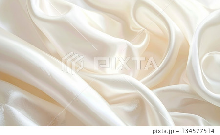 Luxury gold silk satin fabric texture background with smooth shiny waves and elegant soft drapery fashion textile curves 134577514