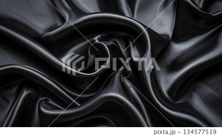 Elegant black satin fabric texture featuring smooth luxury silk waves and a shiny rippled drapery material for a sophisticated fashion background Elegant black satin fabric texture featuring smooth luxury silk waves and a shiny rippled drapery material for a sophisticated fashion background 134577519