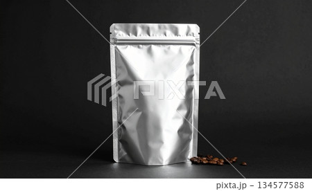 Standing Silver Foil Pouch Mockup on Black Background 134577588