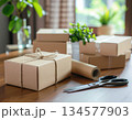 プレゼントの梱包作業　ナチュラルなギフトラッピングイメージ 134577903