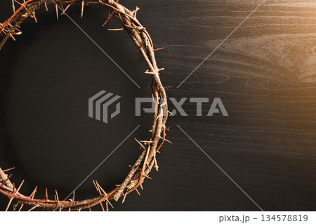 Crown of thorns, wooden cross, iron nail placed on Holy Bible, symbolizing Christian faith, sacrifice, crucifixion, Easter reflection, religion background for worship, spiritual concept Crown of thorns, wooden cross, iron nail placed on Holy Bible, symbolizing Christian faith, sacrifice, crucifixion, Easter reflection, religion background for worship, spiritual concept 134578819
