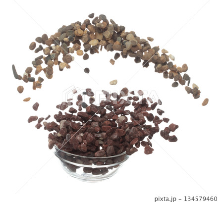 Fish Tank decorative Rock stone gravel fly explosion fall, red stone rock explode abstract cloud fly, splash in air for ground floor. White background isolated high speed shutter freeze shot Fish Tank decorative Rock stone gravel fly explosion fall, red stone rock explode abstract cloud fly, splash in air for ground floor. White background isolated high speed shutter freeze shot 134579460