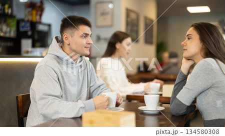 Couple of men and women talking and drinking coffee 134580308