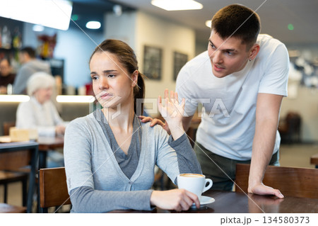 Girl rejects guy. Young man violates personal boundaries of girl Girl rejects guy. Young man violates personal boundaries of girl 134580373