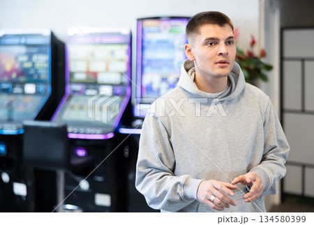 Surprised guy visits slot machine room for first time Surprised guy visits slot machine room for first time 134580399